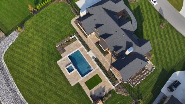 Aerial view of custom backyard pool and patio built by Lattimer Outdoor Living Spaces in Clarence New York