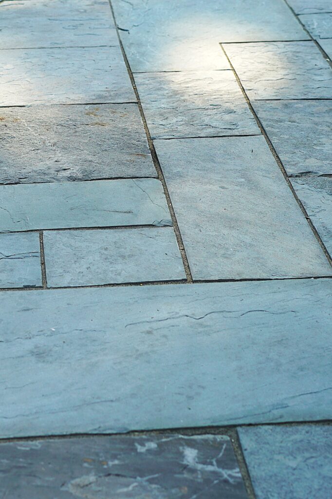 Bluestone patio pavers installed in a linear pattern